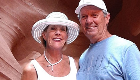 Kaiser Permanente members Robert and Dianna Binkley posing by a cave