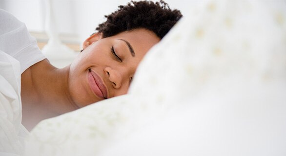 Person sleeping in bed