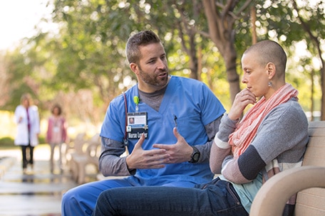 Researcher talking to a patient