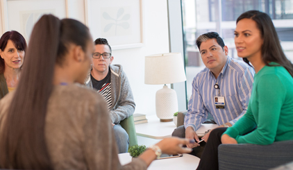 Support group members discussing their recovery