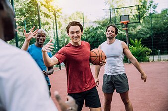 Group of friends playing basketball