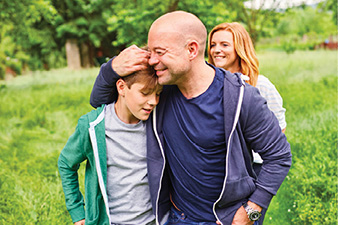 Family walking while hugging