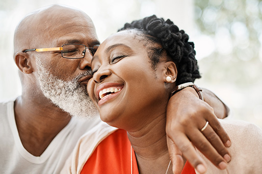 adult and child dancing and laughing together