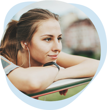 Person wearing earbuds outside