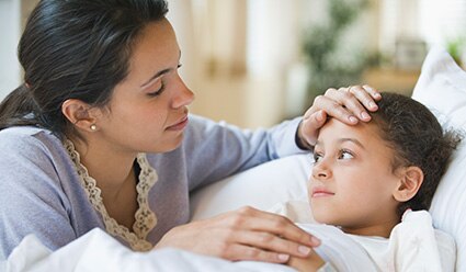 Parent-resting-their-hand-on-sick-childs-forehead-l-dt.jpg