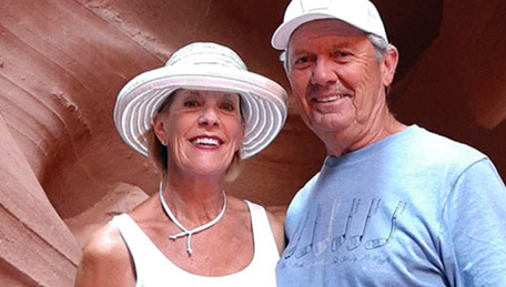 Kaiser Permanente members Robert and Dianna Binkley posing by a cave