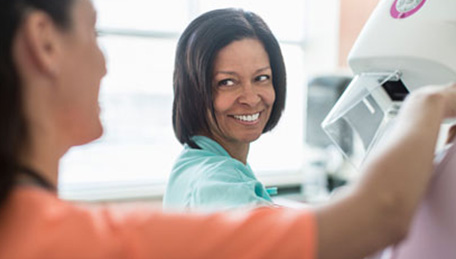 Health care worker and patient preparing for a screening