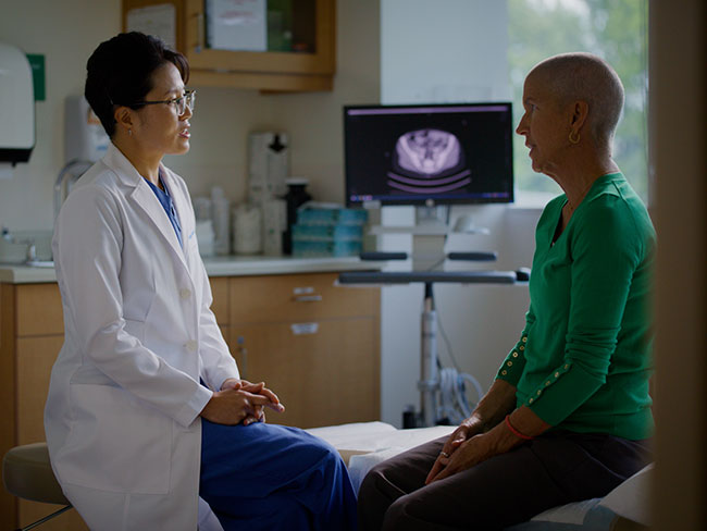 Jenny Hong, MD, talks with Donna Budway about her care.