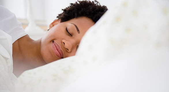 Person sleeping in bed