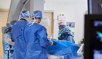 Medical team performing heart surgery on a patient